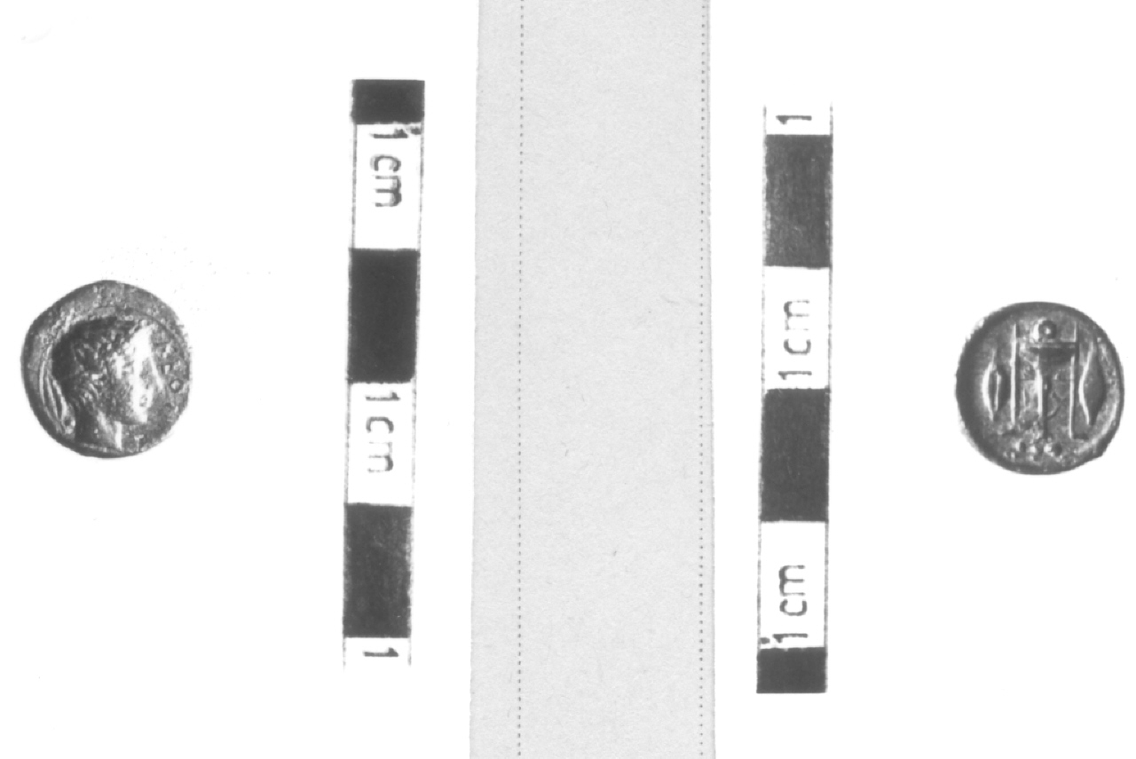 Testa di Apollo / Tripode tra chicchi d'orzo (moneta, triente) (V sec. a.C)