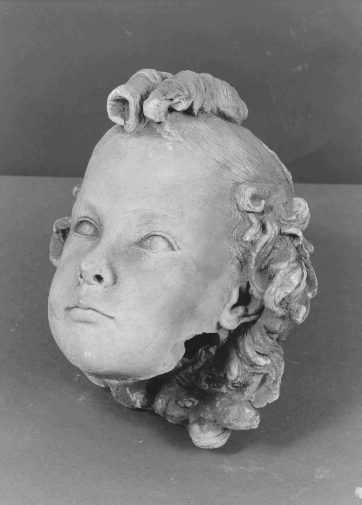 testa di bambina (scultura, frammento) di Berti Antonio (secondo quarto sec. XX)