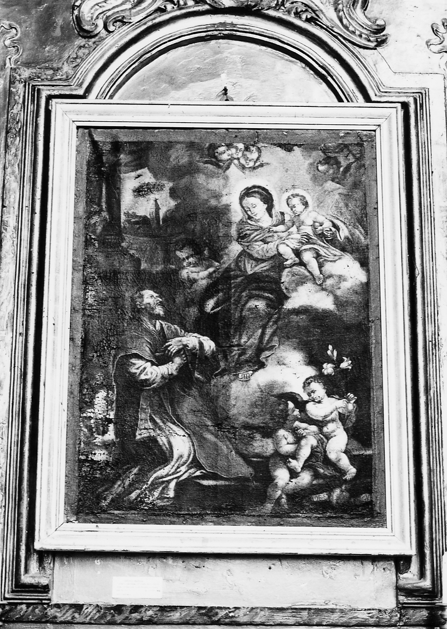Madonna con Bambino in gloria tra santo orante e putti con simboli (dipinto) - ambito Italia centrale (sec. XVIII)