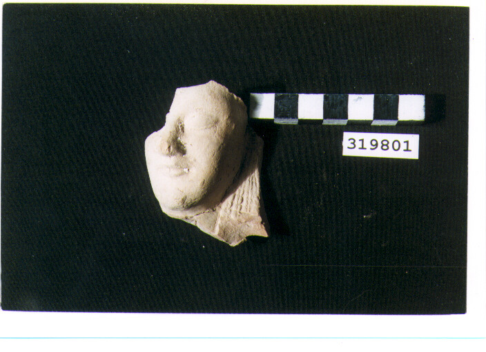 testina di statuetta votiva - produzione magnogreca (seconda metà sec. VI a.C)