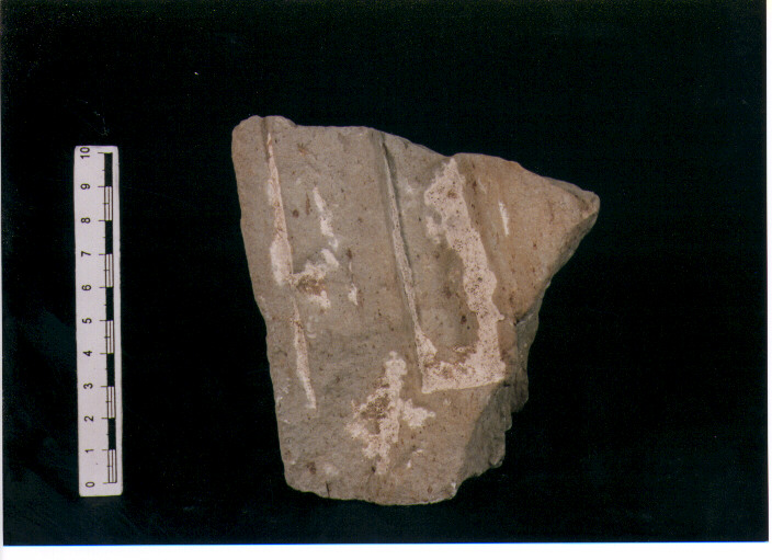 FIGURA UMANA (STELE VOTIVA/ FRAMMENTO) - CIVILTA' PUNICA (secc. IV/ III a.C)