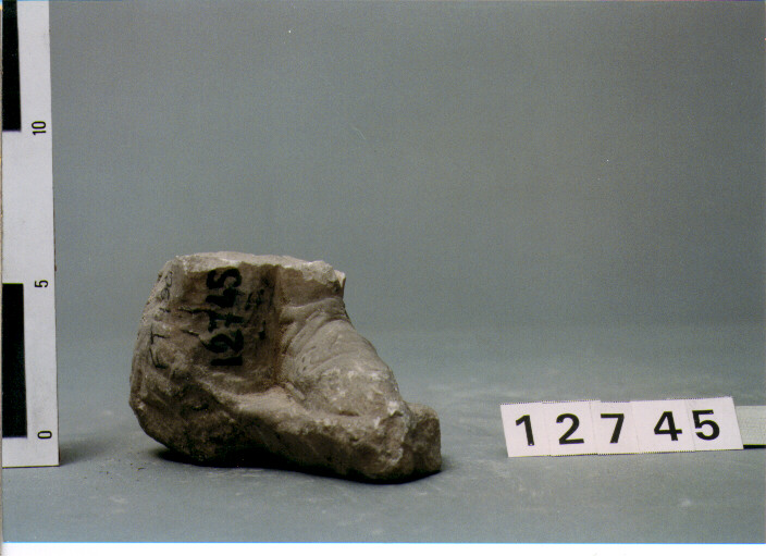 PIEDI DI STATUETTA MASCHILE (SECC. III A.C. / IV D.C)