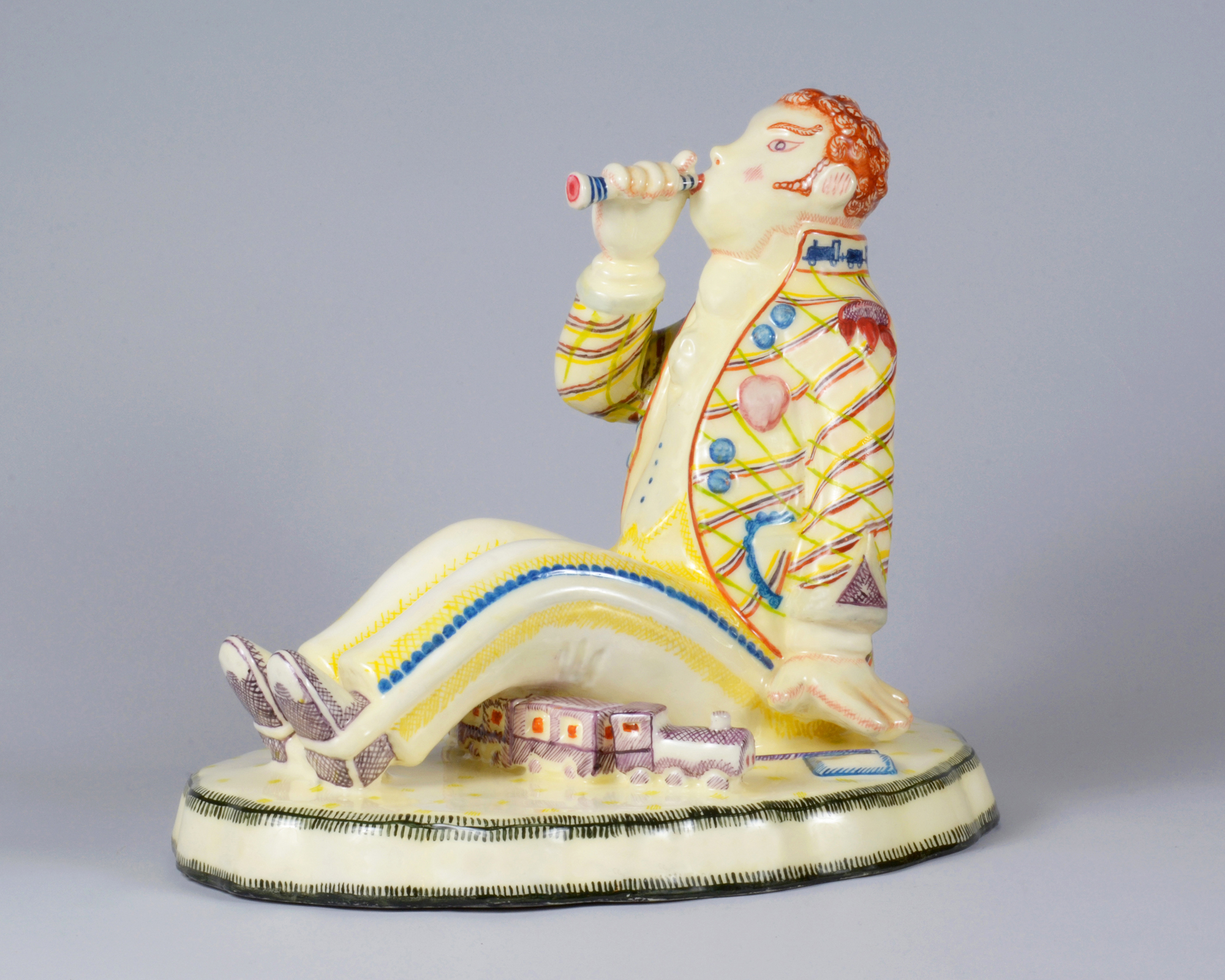 Capotreno, figura maschile con fischietto sopra il treno (statua) di Sturani Mario, Fabbrica Lenci (anni venti sec. XX)