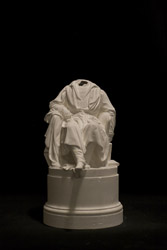 Figura maschile seduta, raffigurazione di un personaggio maschile seduto in poltrona (statuetta, opera isolata) di Puttinati Alessandro (sec. XIX)
