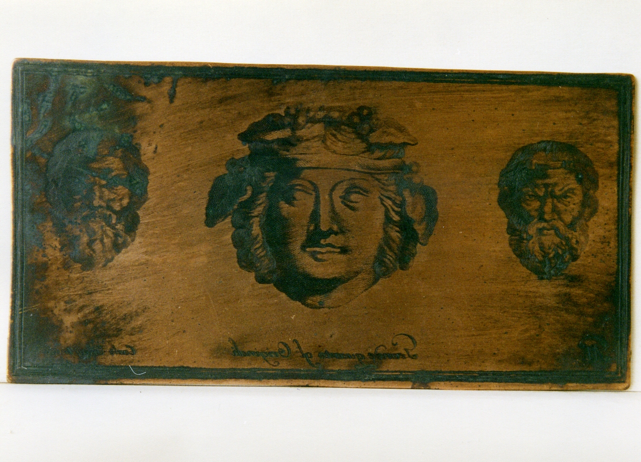 tre appliques di bronzo: mascherette virili e mascheretta bacchica (matrice) di Orazi Carlo, Morghen Giovanni Elia (sec. XVIII)