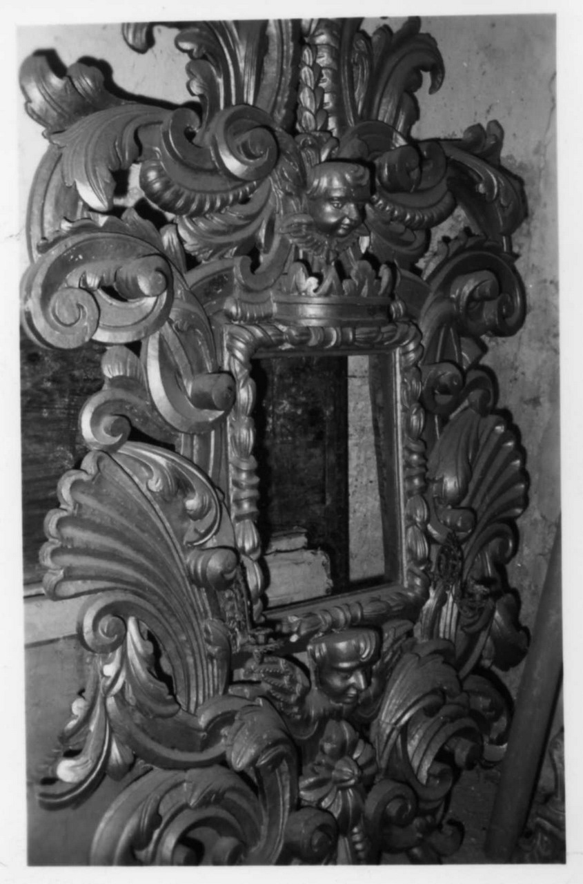 cherubini e motivi decorativi a volute (cornice di dipinto) - bottega modenese (seconda metà sec. XVII)