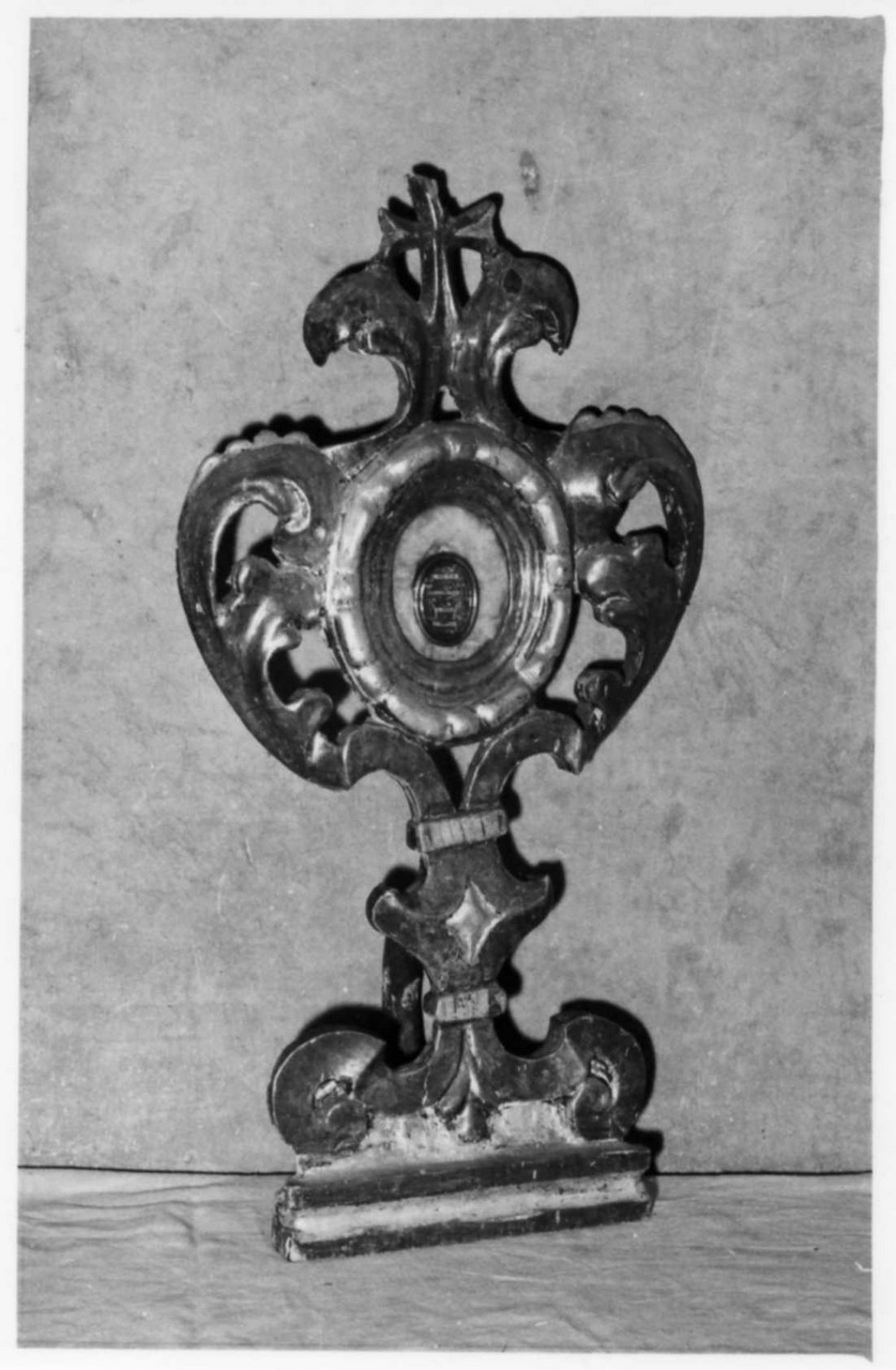 cherubini e motivi decorativi a volute (reliquiario - a ostensorio, serie) - bottega modenese (prima metà sec. XVIII)