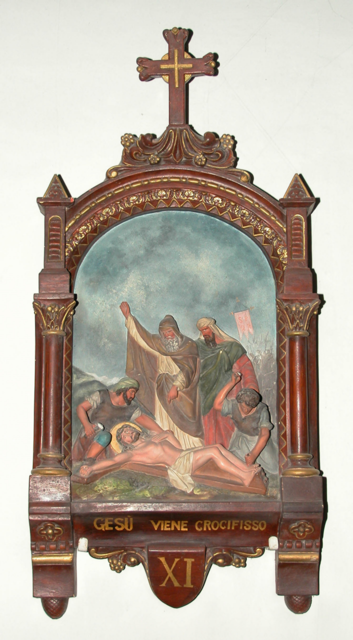 stazione XI: Gesù inchiodato alla croce (Via Crucis, elemento d'insieme) di Costantini Costantino (inizio sec. XX)