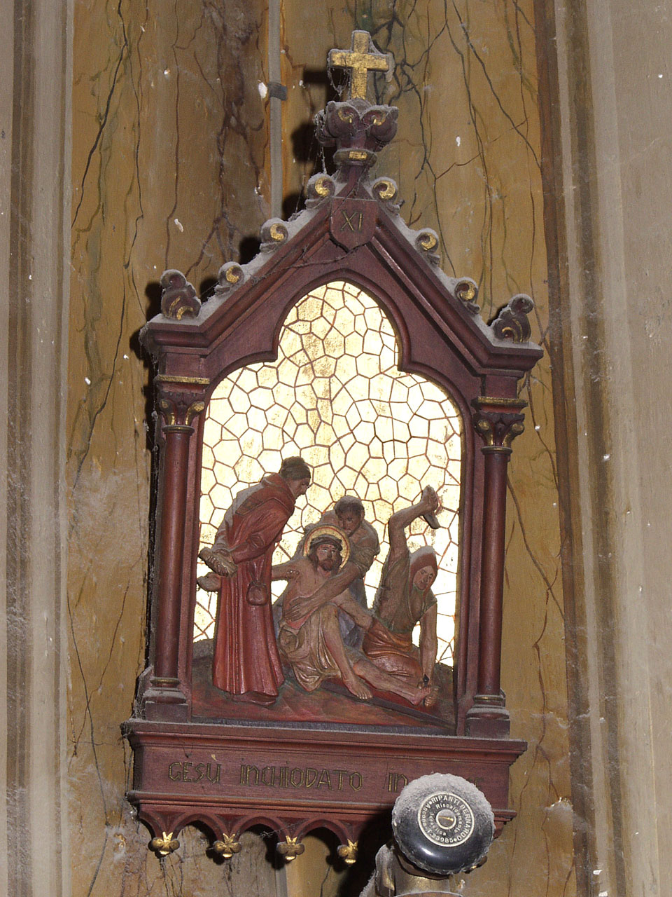stazione XI: Gesù inchiodato alla croce (Via Crucis, elemento d'insieme) - bottega marchigiana (prima metà sec. XX)
